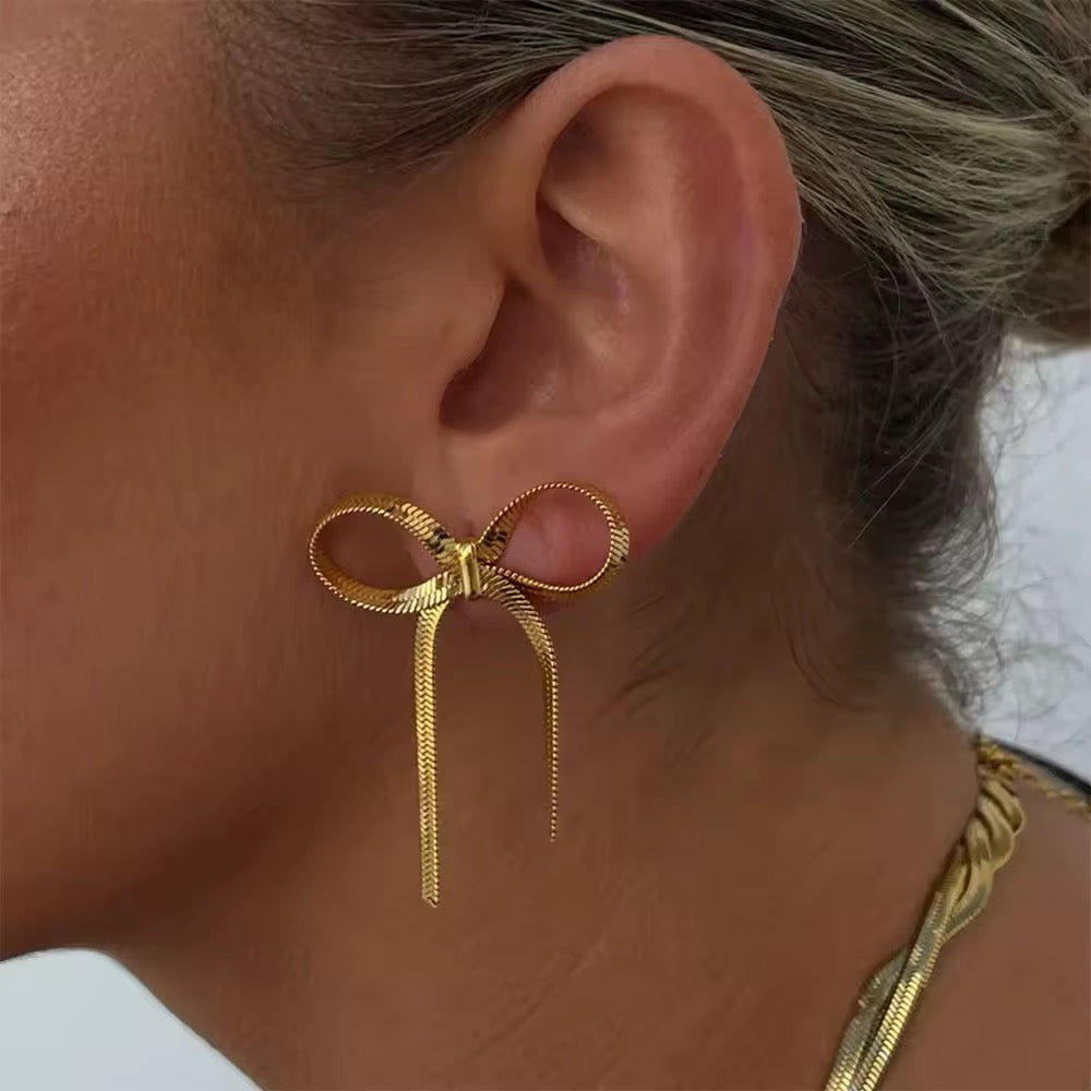 Elegant golden bow earrings