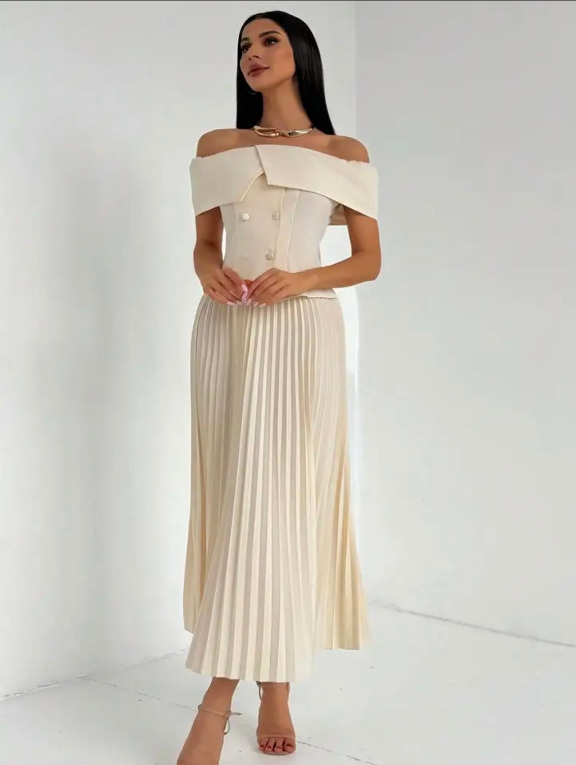 Elegant off-shoulder maxi dress with pleated skirt in cream