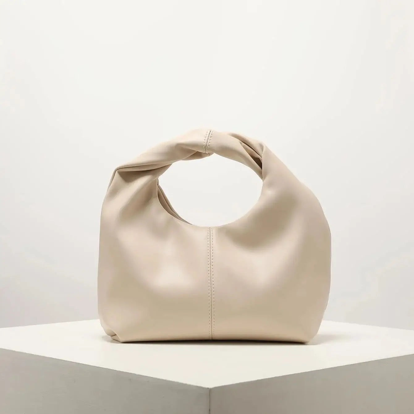 Elegant black handbag with knot handle