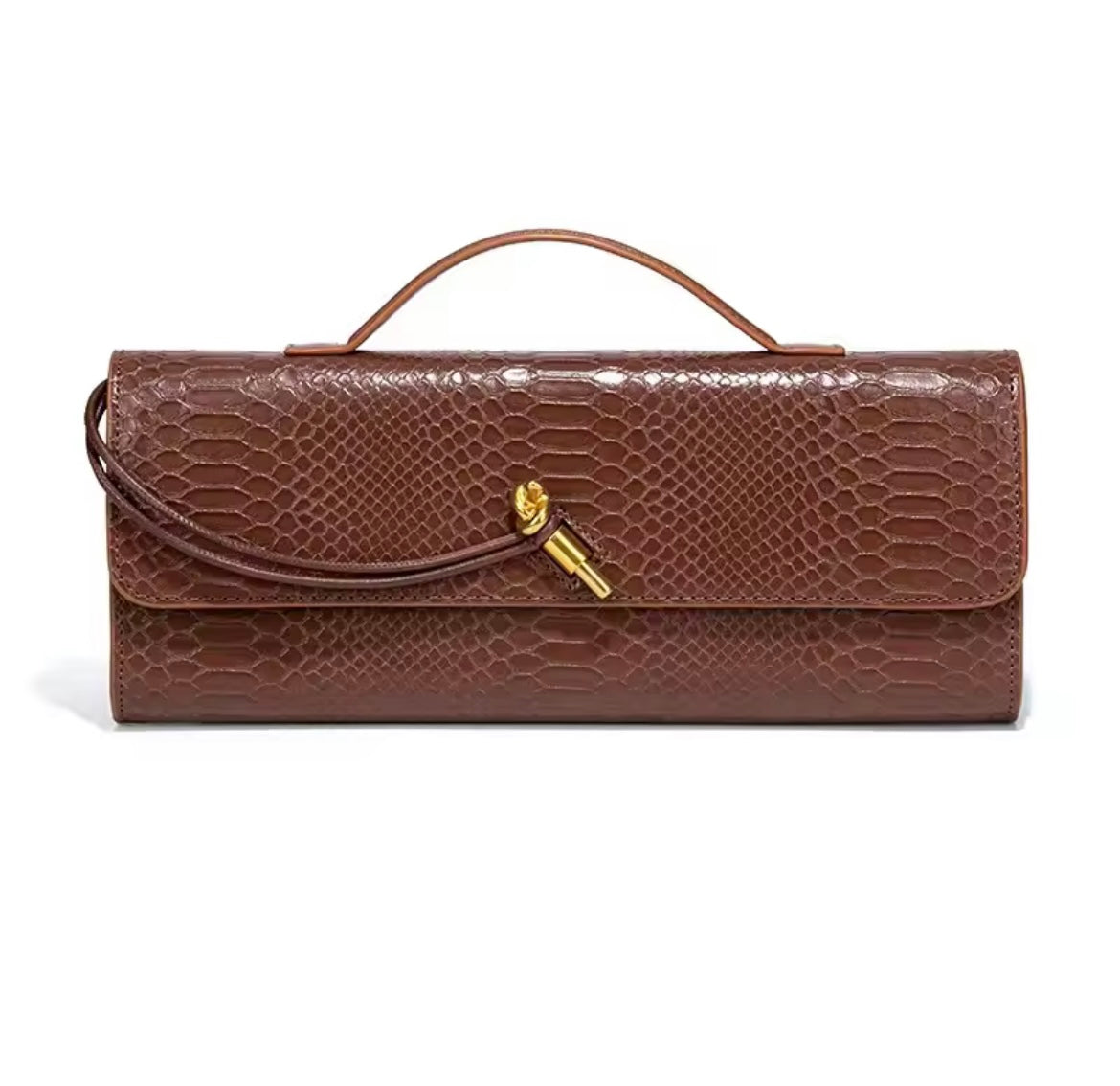Luxurious clutch bag in crocodile look