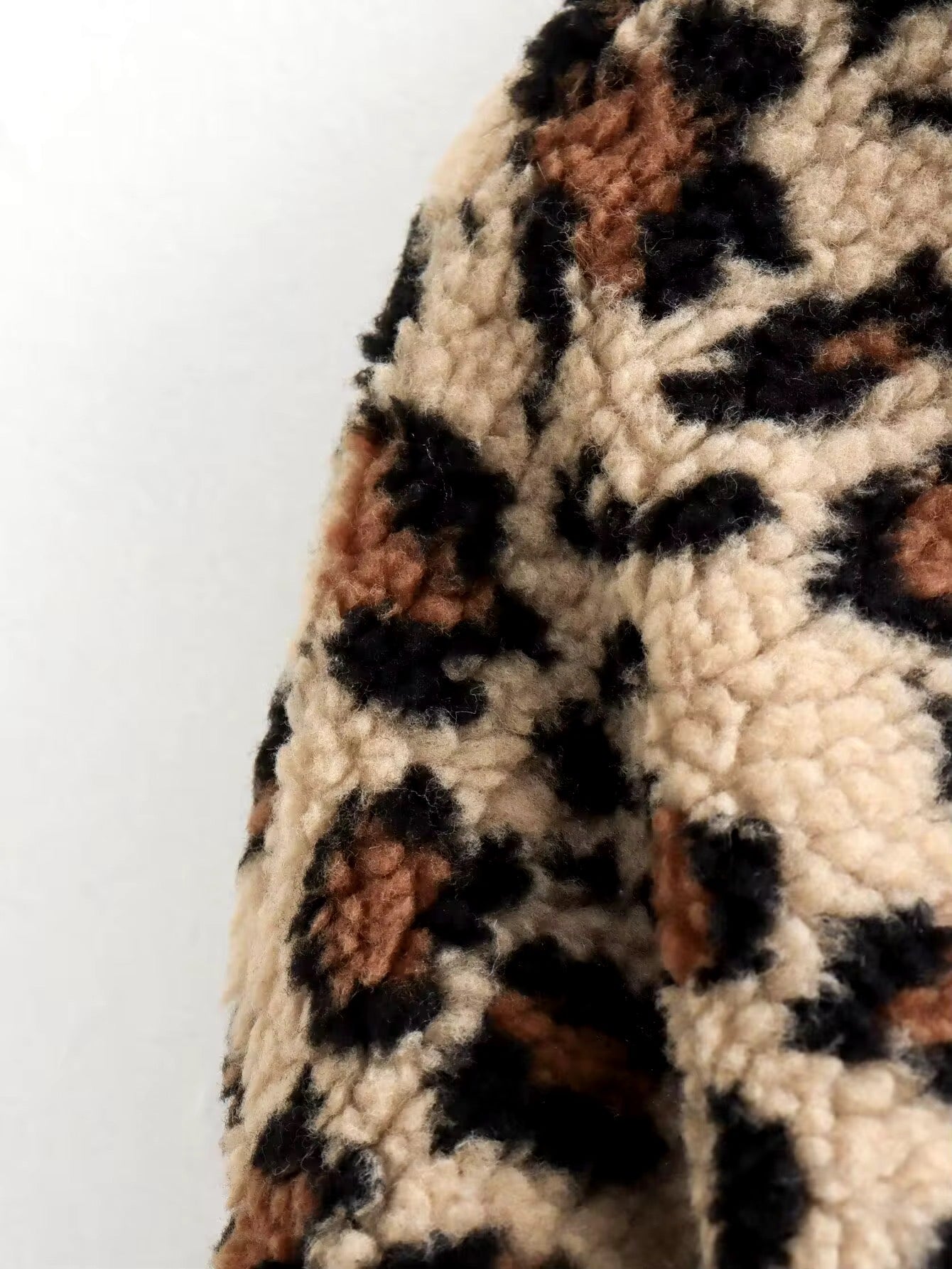 Cozy leopard cardigan with button placket