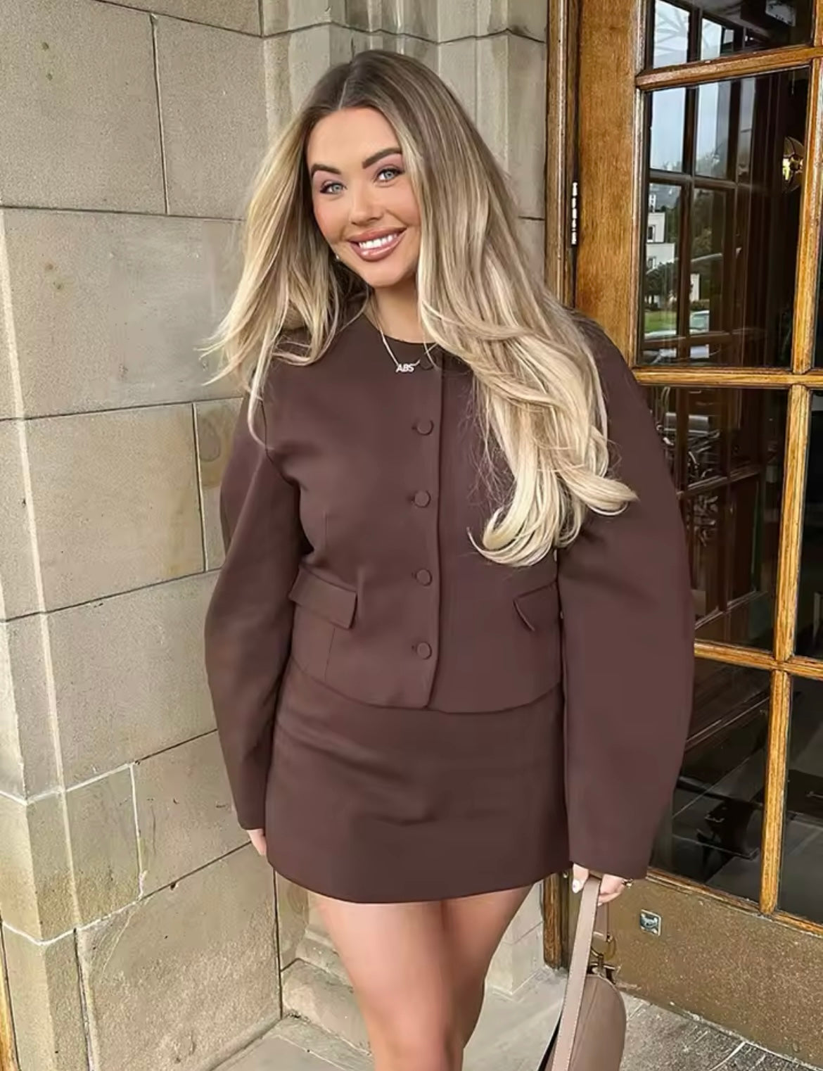 Two-piece set of jacket and miniskirt in brown