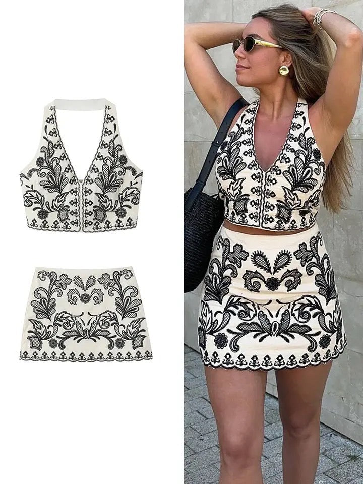 Elegant black and white embroidered crop top and skirt set