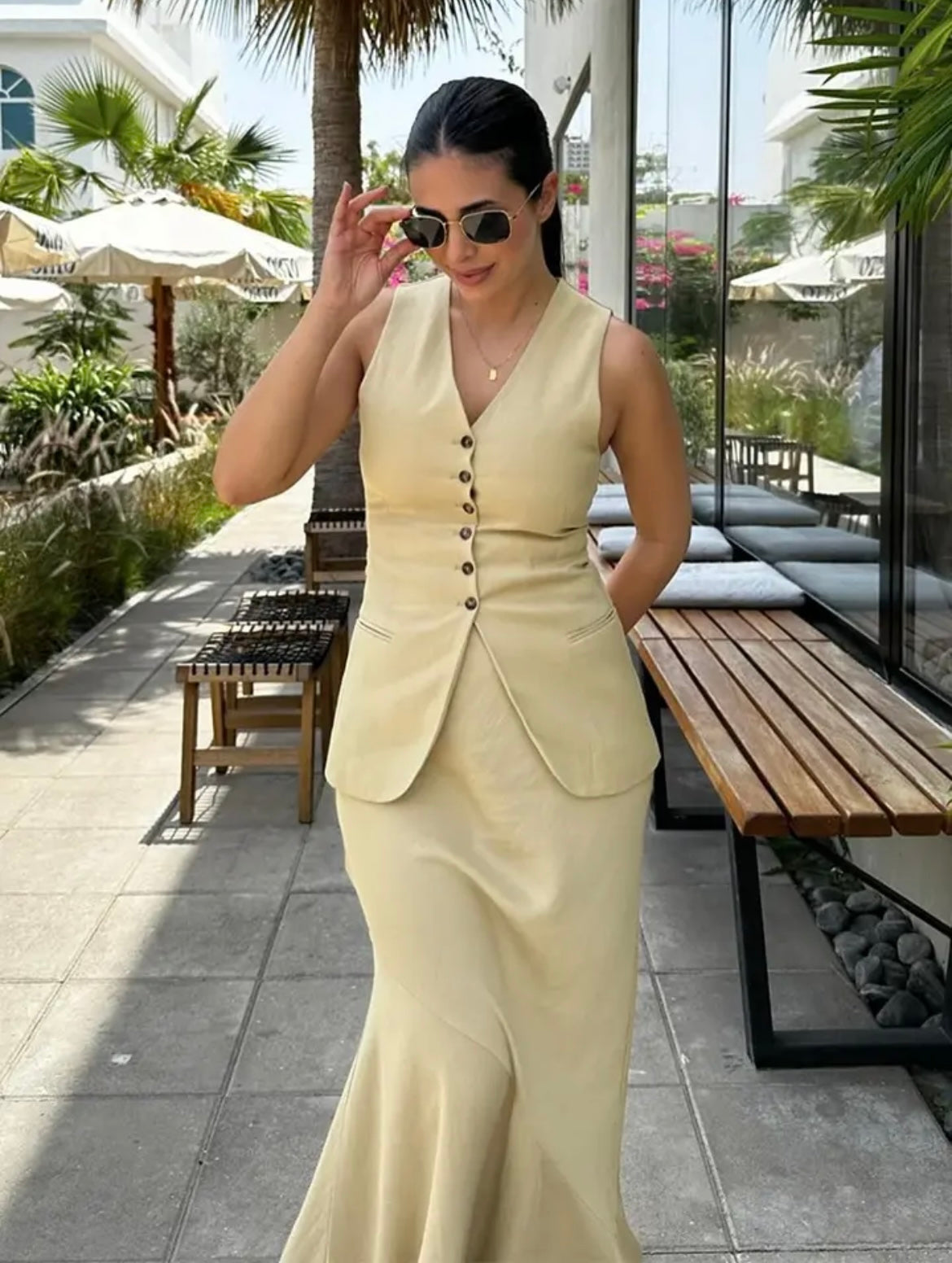 Two-piece women's outfit with vest and skirt in beige