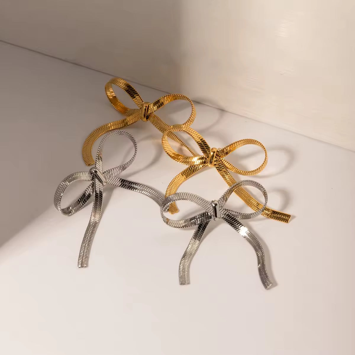 Elegant golden bow earrings