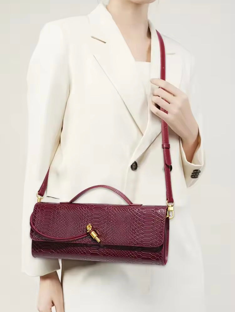 Luxurious clutch bag in crocodile look