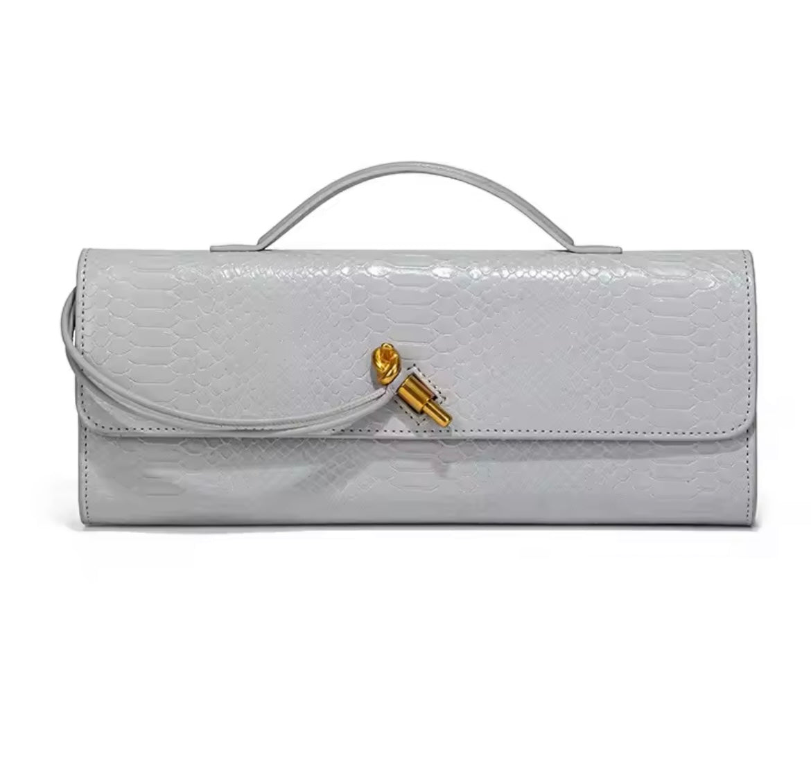 Luxurious clutch bag in crocodile look