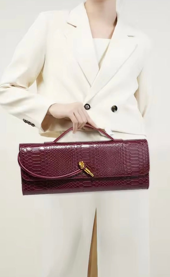 Luxurious clutch bag in crocodile look