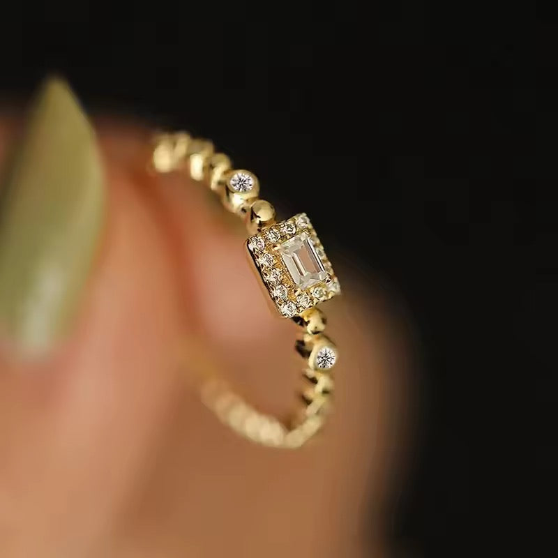 gold-plated ring with rectangular zirconia stone