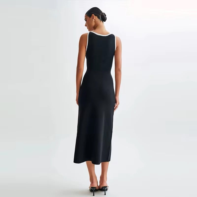 Elegant black and white dress with gold button details