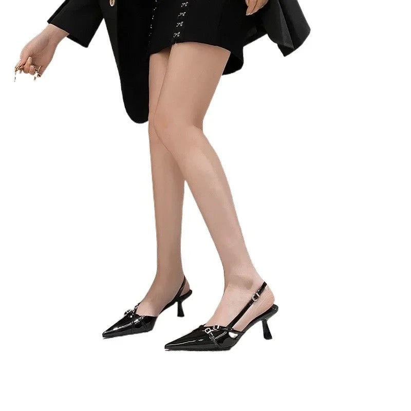 Black patent leather slingback pumps with straps