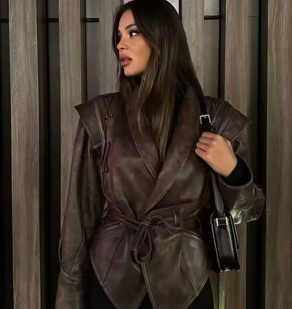 Dark brown leather jacket with lacing details and tie belt