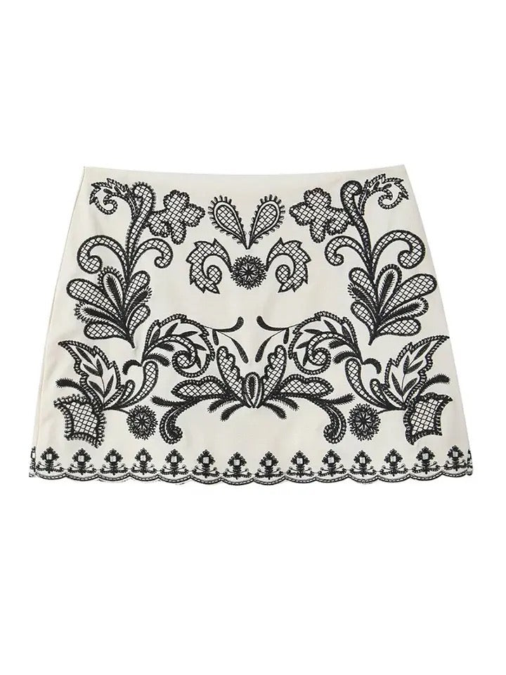 Elegant black and white embroidered crop top and skirt set