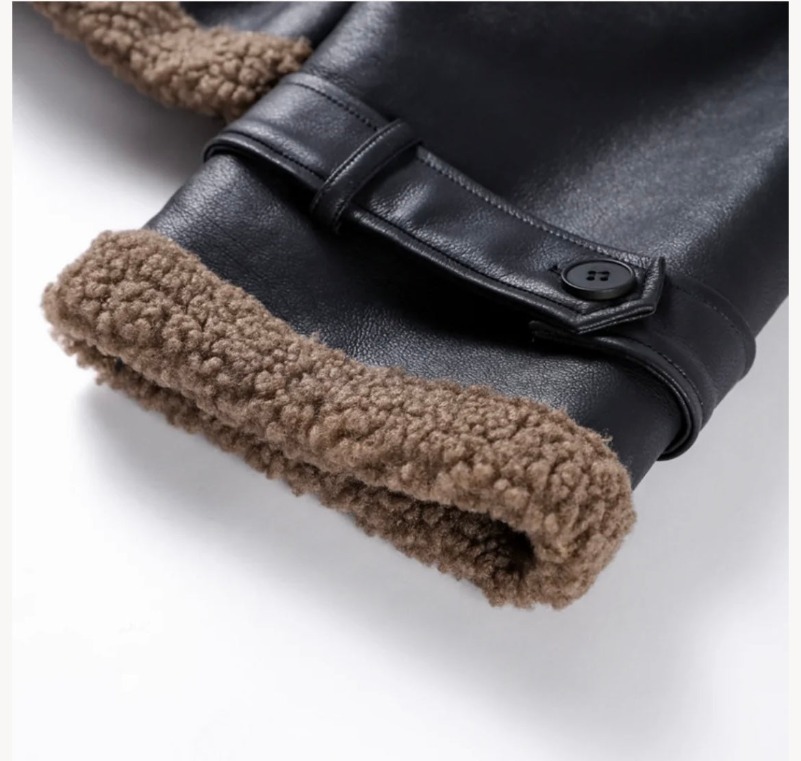 Women's faux leather jacket with teddy fur lining and belt