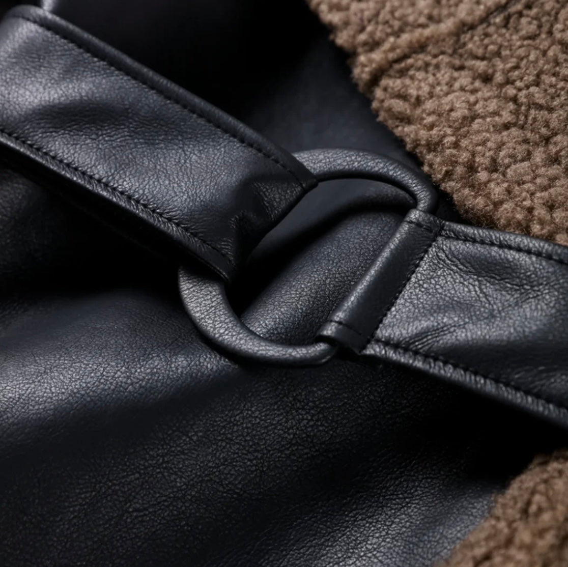 Women's faux leather jacket with teddy fur lining and belt
