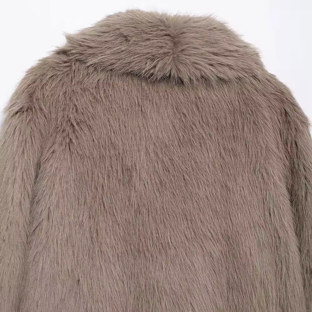 Manteau élégant en fausse fourrure